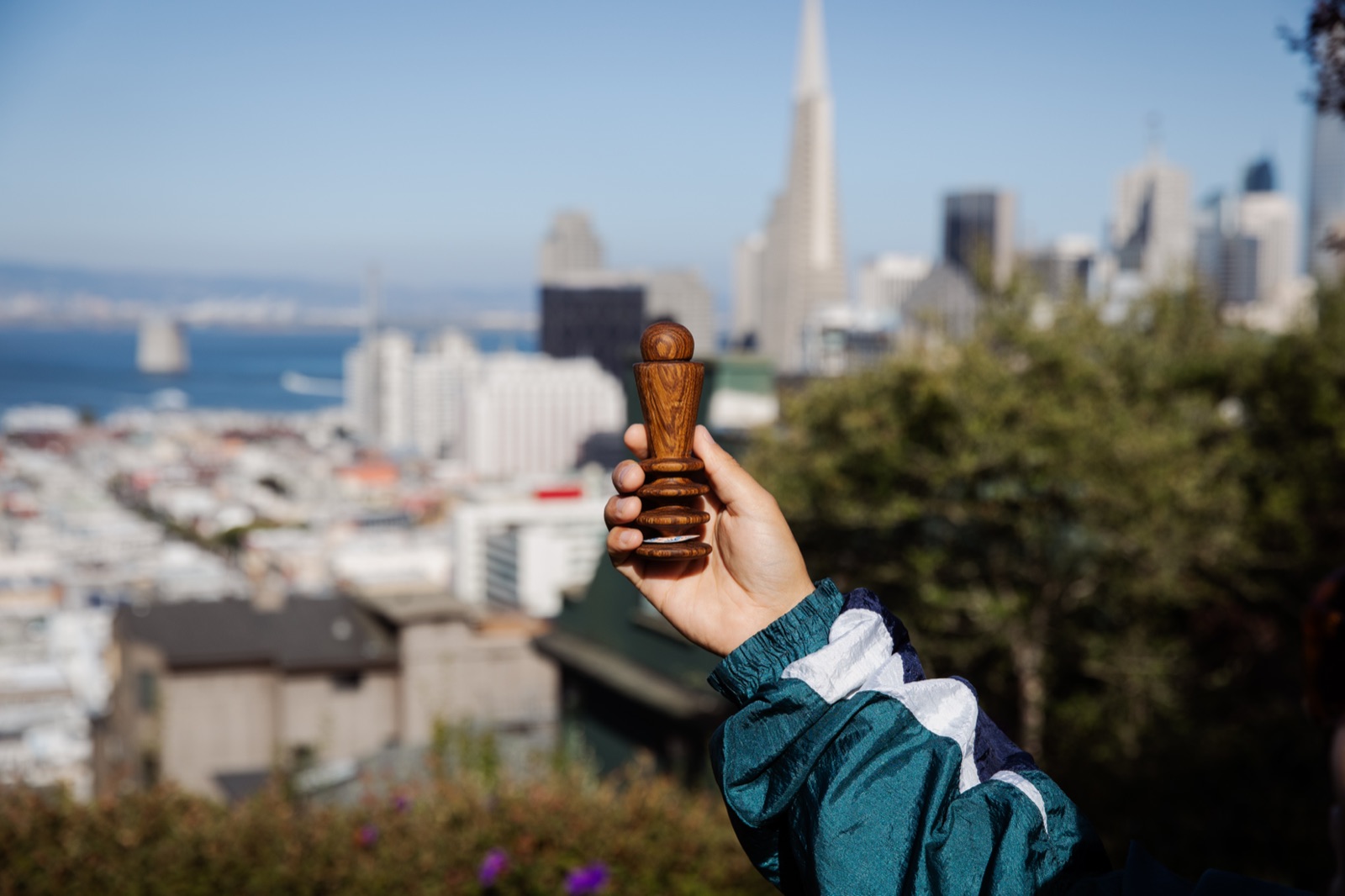 An Edger held up against the San Francisco skyline and the Transamerica Pyramid